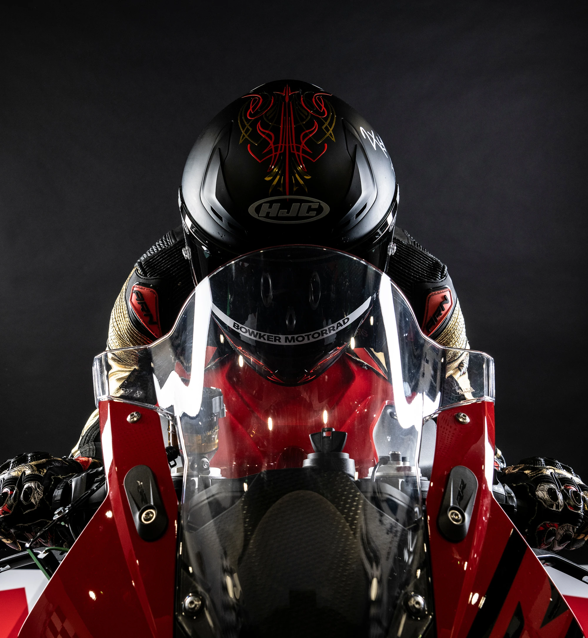 Professional rider in full race position on the Plenitus Racing Sim