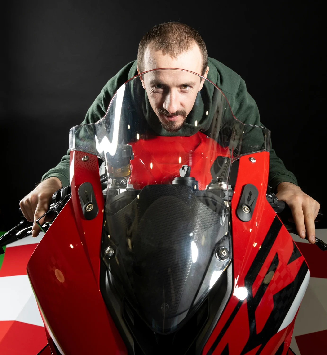 Rider practising race position on the Plenitus Racing Sim