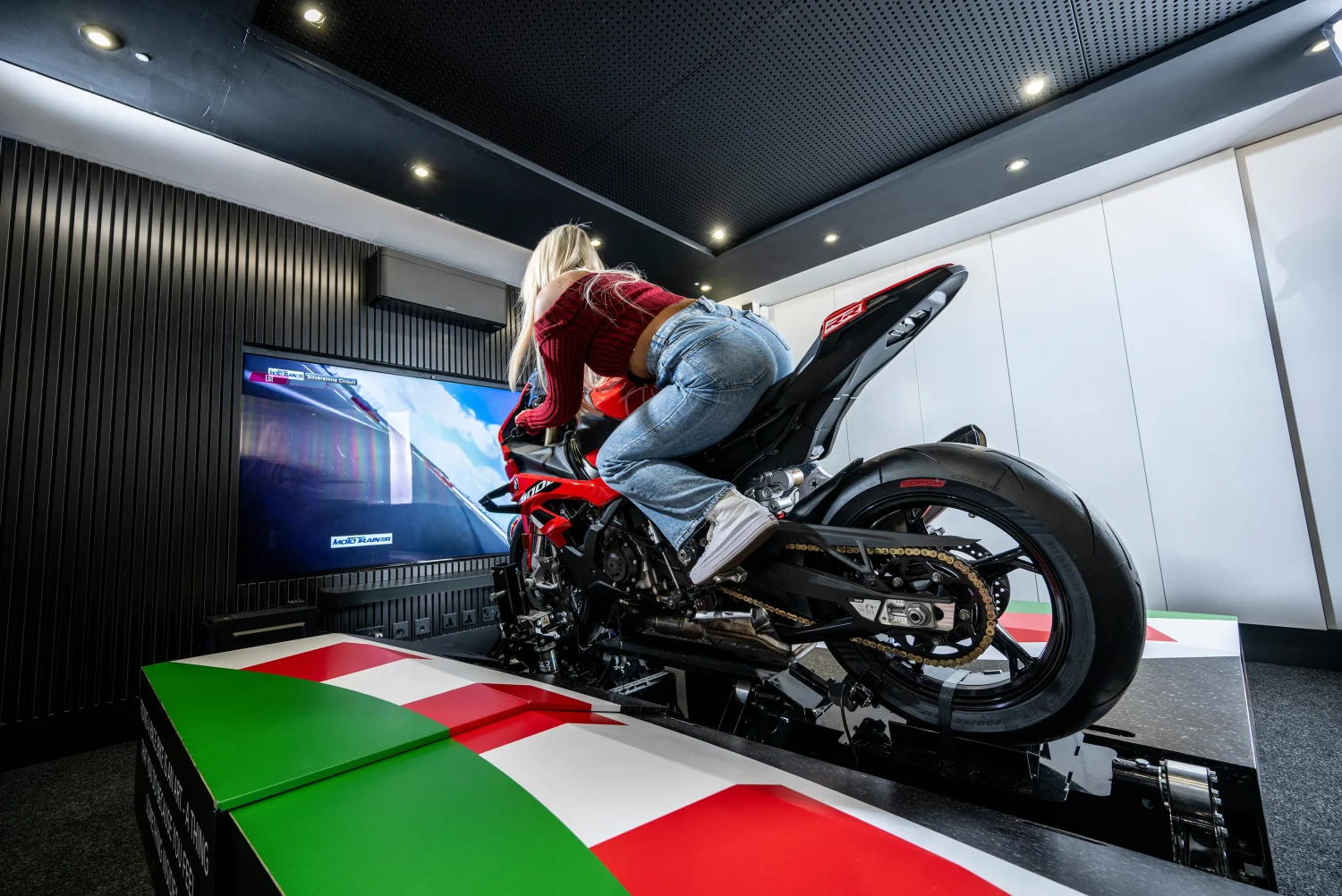 Rider practising on the Plenitus Racing Sim while navigating a virtual circuit