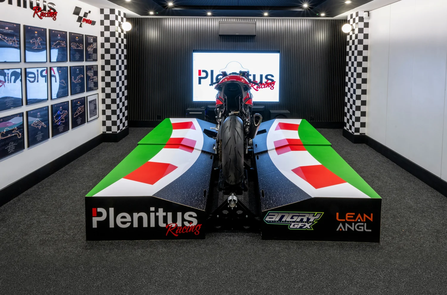 Plenitus Racing Sim room with full lean platform and rider training setup